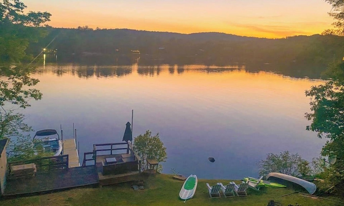 Castleton House | Lakefront home near ski resorts with water view, dock, deck, fireplaces, & W/D