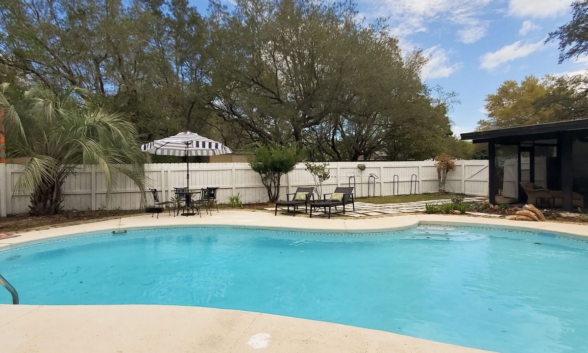 Navarre House | Updated dog-friendly home with private outdoor pool, patio, fireplace, W/D, AC