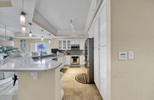 Panama City Beach Condo | 1/2 mile to Pier Park! Beautiful beachfront 3 BR, 3 BA Condo w/wrap around deck