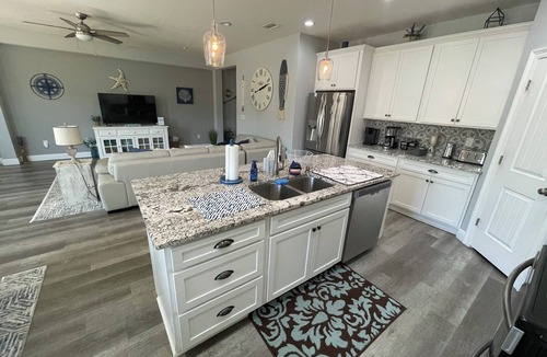 Thomas Drive House | Charming 3-bedroom house with pool, fire pit and grill in Panama City Beach.