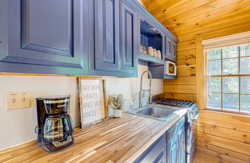 Lincolnville Cabin | Charming log cabin with firepit, lovely interior, and cozy patio/deck