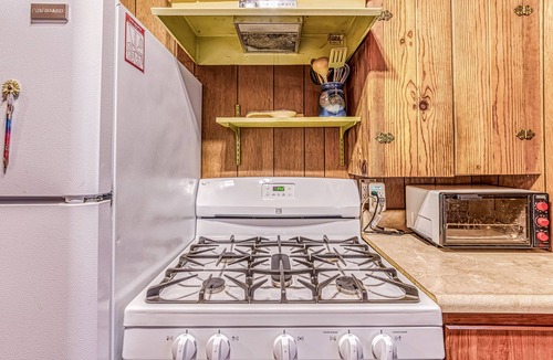 West Village Cabin | Cozy cabin in the trees with deck, grill, wood-burning fireplace, WiFi, & W/D
