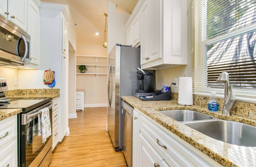 East Hill House | Cozy Carriage House with Pool, Bikes, and Charming Neighborhood
