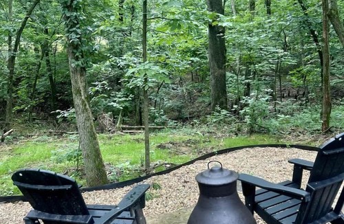 Gentry RV Rental | Enchanting Mountain Glamping Tents with Elevated Decks and Fire Pit Near Gentry, AR