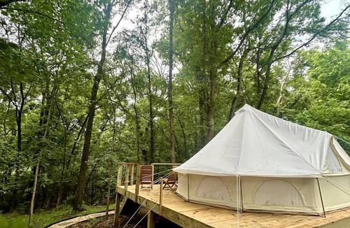 Gentry RV Rental | Enchanting Mountain Glamping Tents with Elevated Decks and Fire Pit Near Gentry, AR