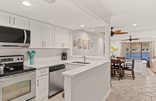 Sandestin Condo | Lakefront Villa w/2 GOLF CARTS! Screened Porch, Bay Views. Near Beach & Pool