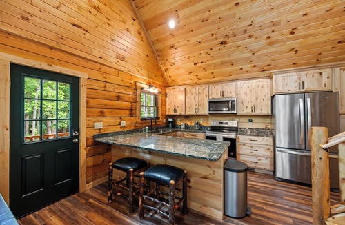 Union Hall Cabin | Main Channel Lots of Water-All Decked Out — new lakefront log home on Smith Mountain Lake with a private hot tub, 50+ ft of wraparound deck, fire pit patio & easy lake access. Two full kitchens. One of 5 cabins on an 8-acre lakefront micro-resort.