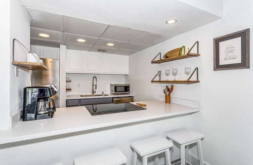 Villa Sabine Condo | New! Centrally located 1 bed 1.5 bath with water views!