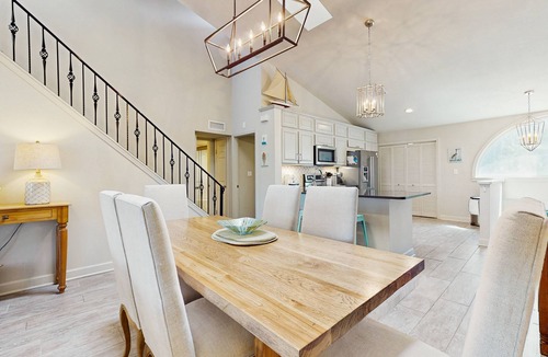 Sandestin Condo | Perfectly located home with golf cart, open layout, smart TVs, W/D, & pools