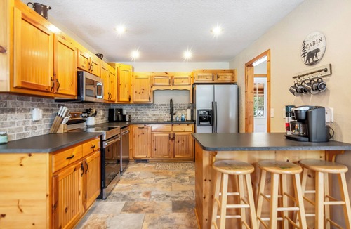 Hiawassee House | Riverfront cabin, arcade, hot tub, pool, trout fishing, pet friendly