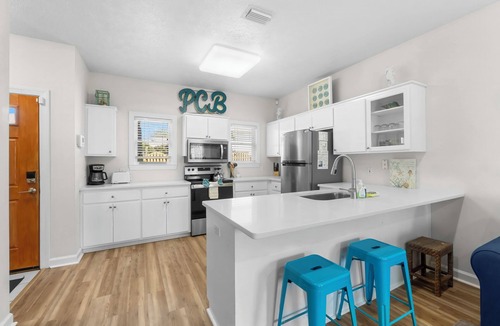 Bel Air House | Spacious Beachside Townhouse with Lagoon access, 2 car garage, and a pool!l