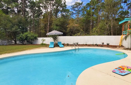 Navarre House | Updated dog-friendly home with private outdoor pool, patio, fireplace, W/D, AC