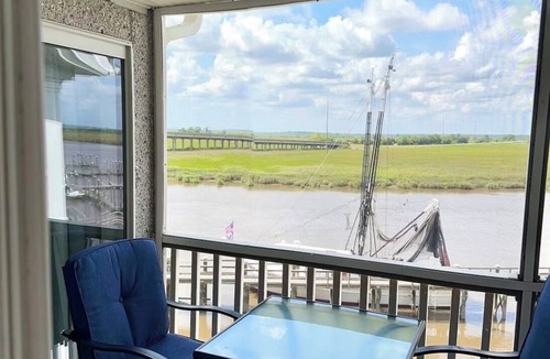 Darien Condo | Wake Up on the River! Walk to charming Downtown Darien. w/boat slip