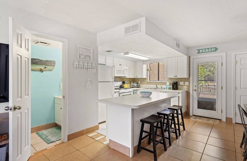 Panama City Beach House | ❃ Walkable to Food & Fun ❃ Beach-Front Pool ❃ Canal-Side Home ❃ No Pet Fee