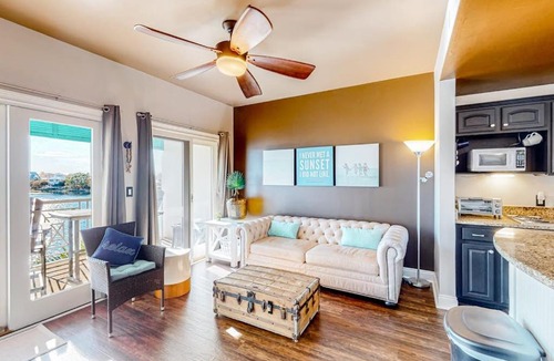 Sunnyside Apartment | Water-view condo with on-site pool hot tub beachfront access & sports courts