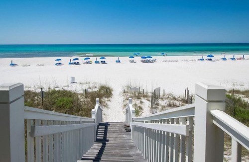 Sunnyside Apartment | Water-view condo with on-site pool hot tub beachfront access & sports courts