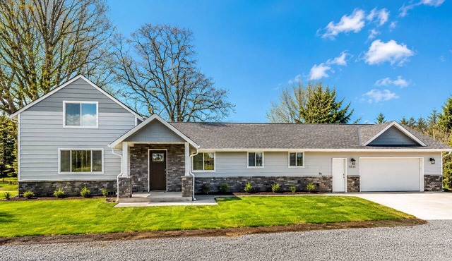 Beautiful like new home with a large hot tub in a quiet neighborhood on Acreage.