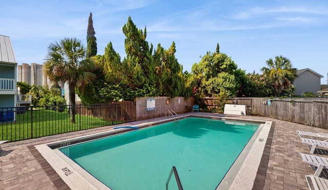 Cozy coastal condo with a loft, shared pool and beach access