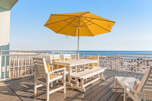 Dog-friendly beachfront dream with a wet bar & two furnished balconies