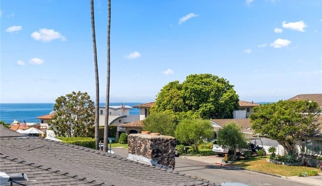 Family home in ideal beach location. Spacious 4 BR home with ocean view.