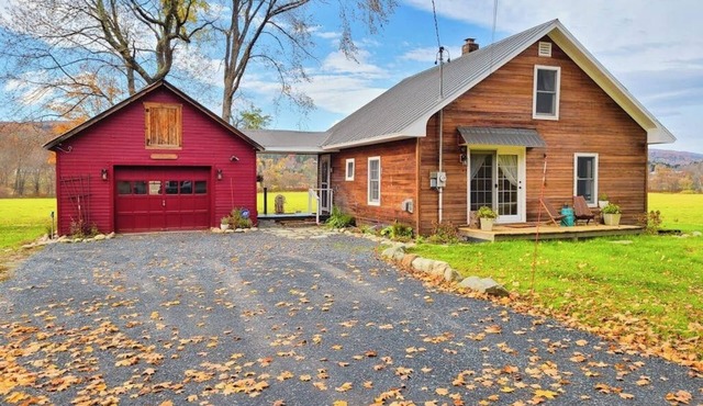 Historic home on 1 acre with snowmobile trails in backyard & mountain views