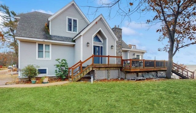 Lakefront home with water access, views of the mountains, private deck & patio in Colchester