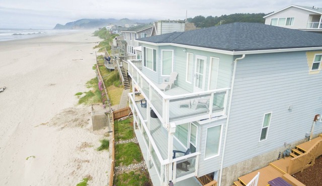 Oceanfront home with sweeping views and multiple decks, just steps to the beach!