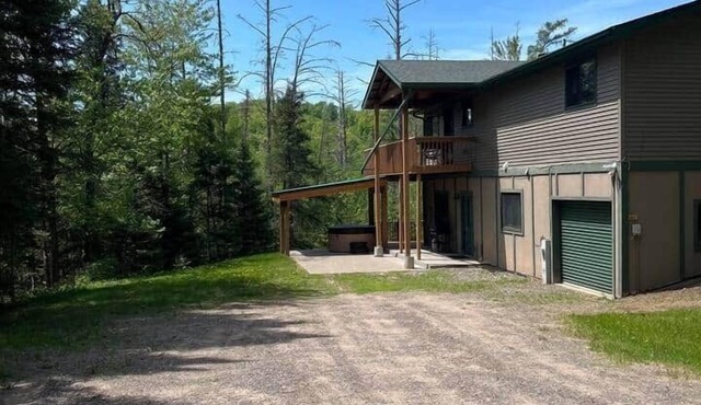 Ski getaway with hill view and hot tub- Lower unit