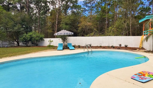 Updated dog-friendly home with private outdoor pool, patio, fireplace, W/D, AC