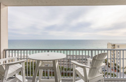 Pensacola Beach Condo | Spacious, open layout floor to ceiling with a wrap around balcony - ED1250