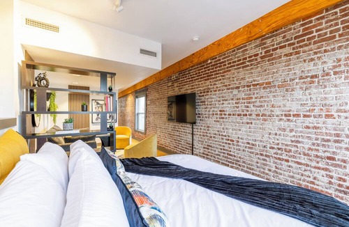 Rogers Apartment | Urban Brick Loft Studio Ride to Trails Walk to Dining, Shops & Nightlife